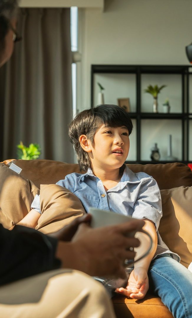 A child talking with a supportive adult at home